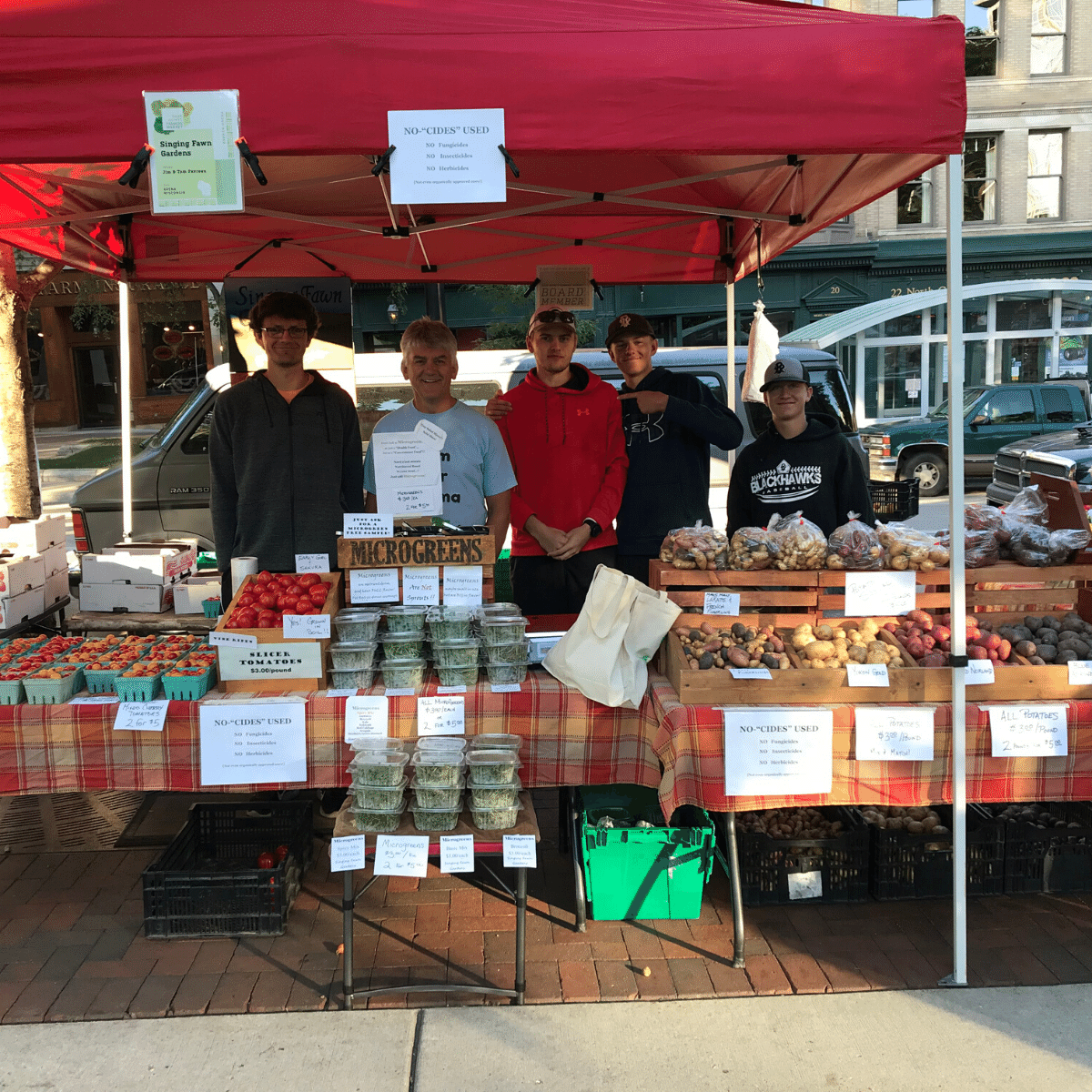 The Singing Fawn Gardens family at their Dane County Farmers' Market booth